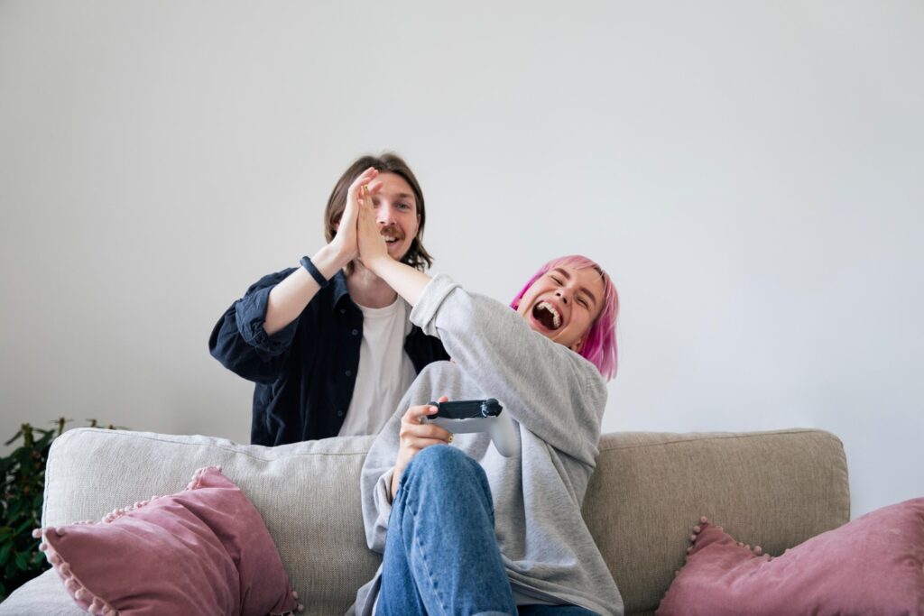 young couple playing video game home